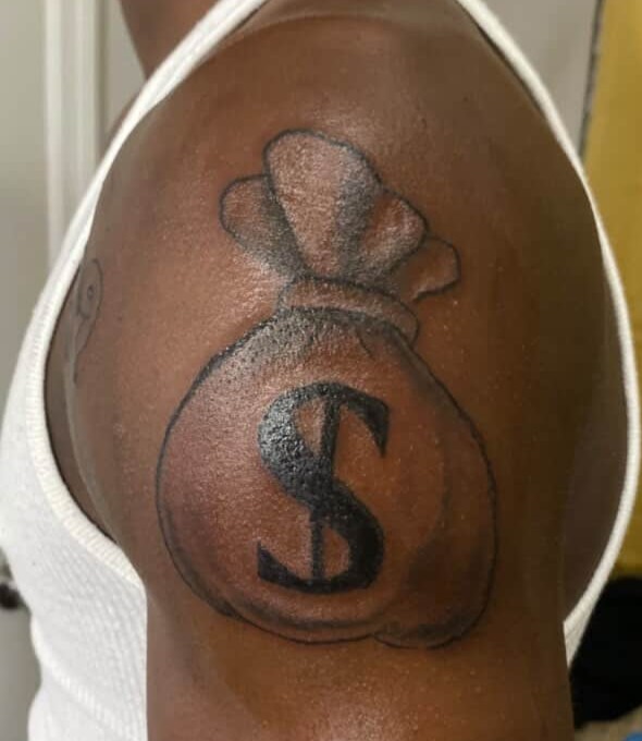 Money bag tattoo on shoulder