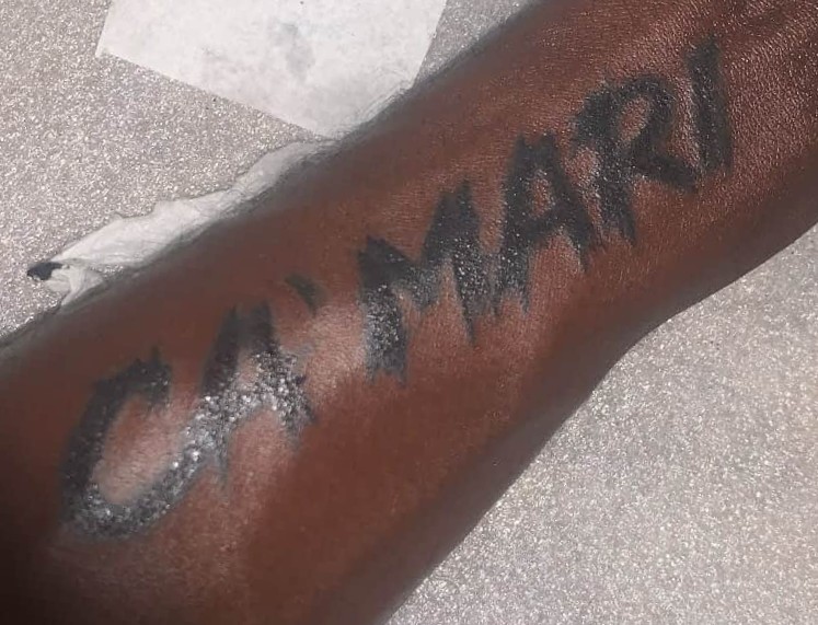 Custom script tattoo on back forearm
